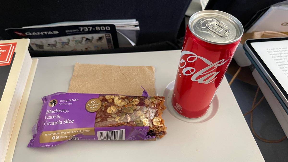 a can of soda next to a snack bar