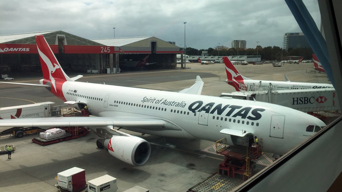 a large white airplane parked at an airport