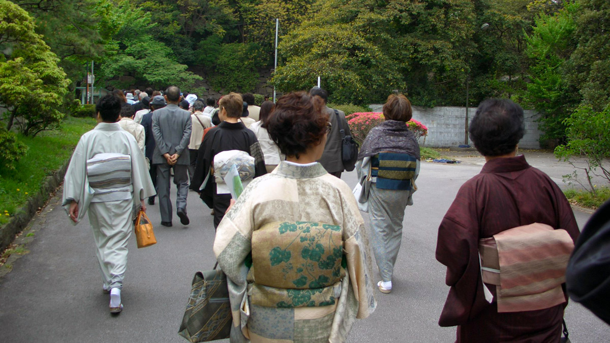 a group of people walking on a road