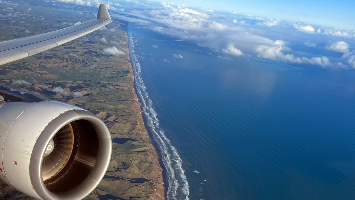 Qantas A330 wing and engine leaving Auckland New Zealand for Brisbane, Australia