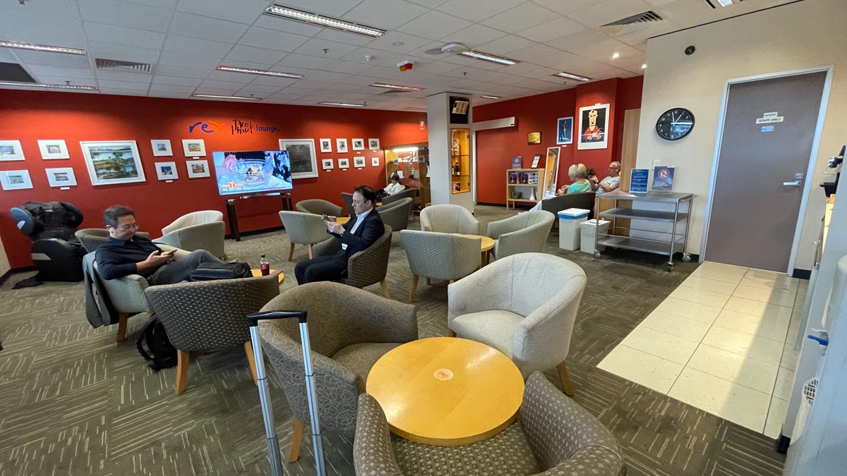 a group of people sitting in chairs in a room