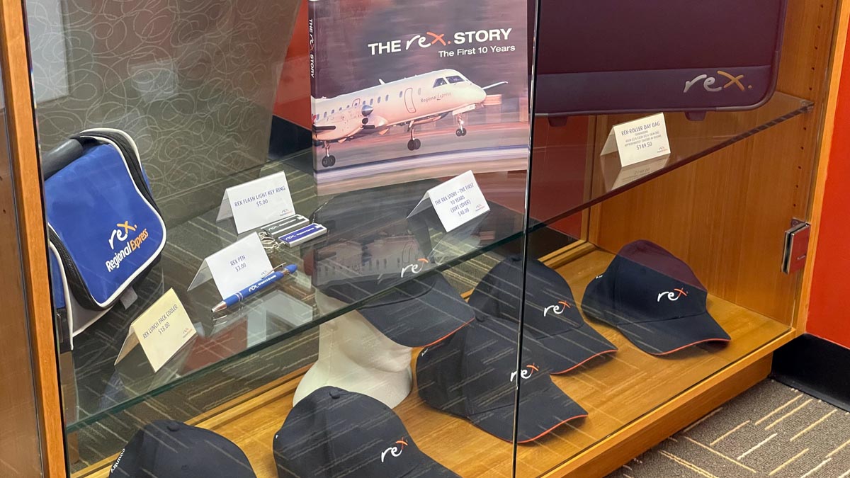 a display case with hats and pens