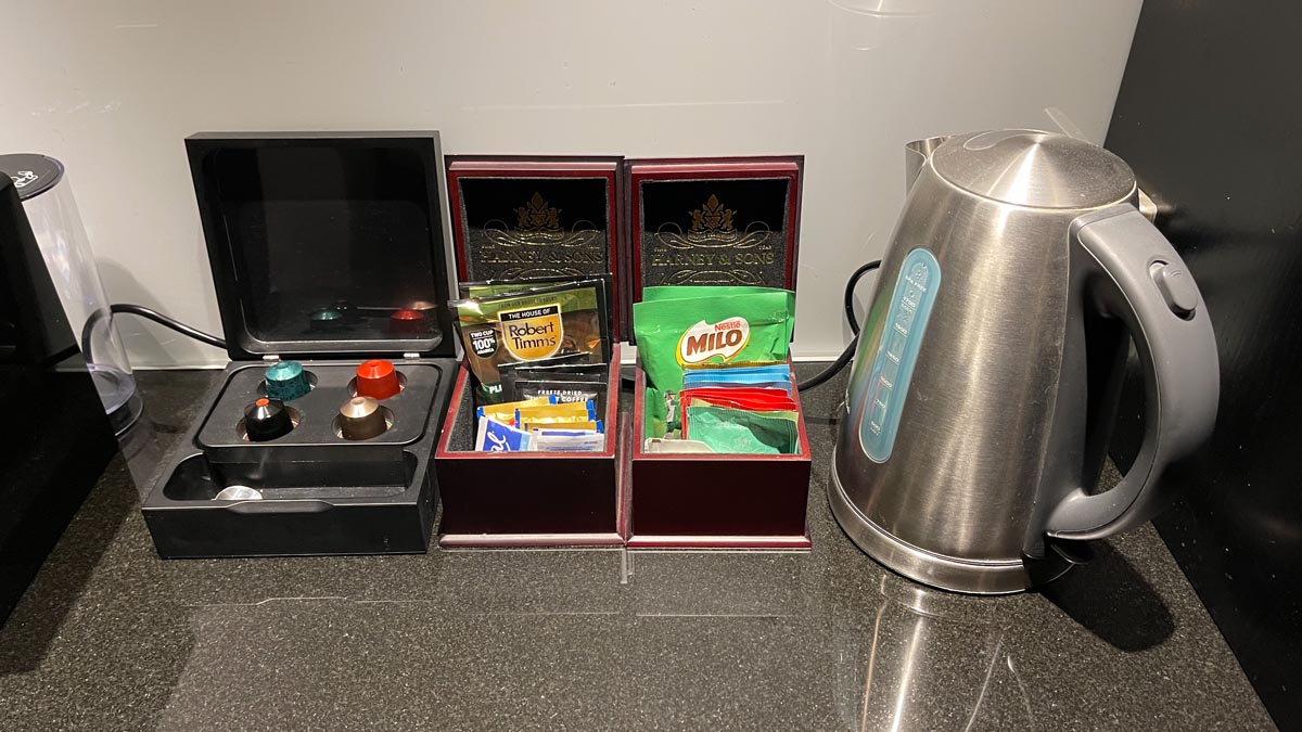 a tea kettle and tea bags on a counter