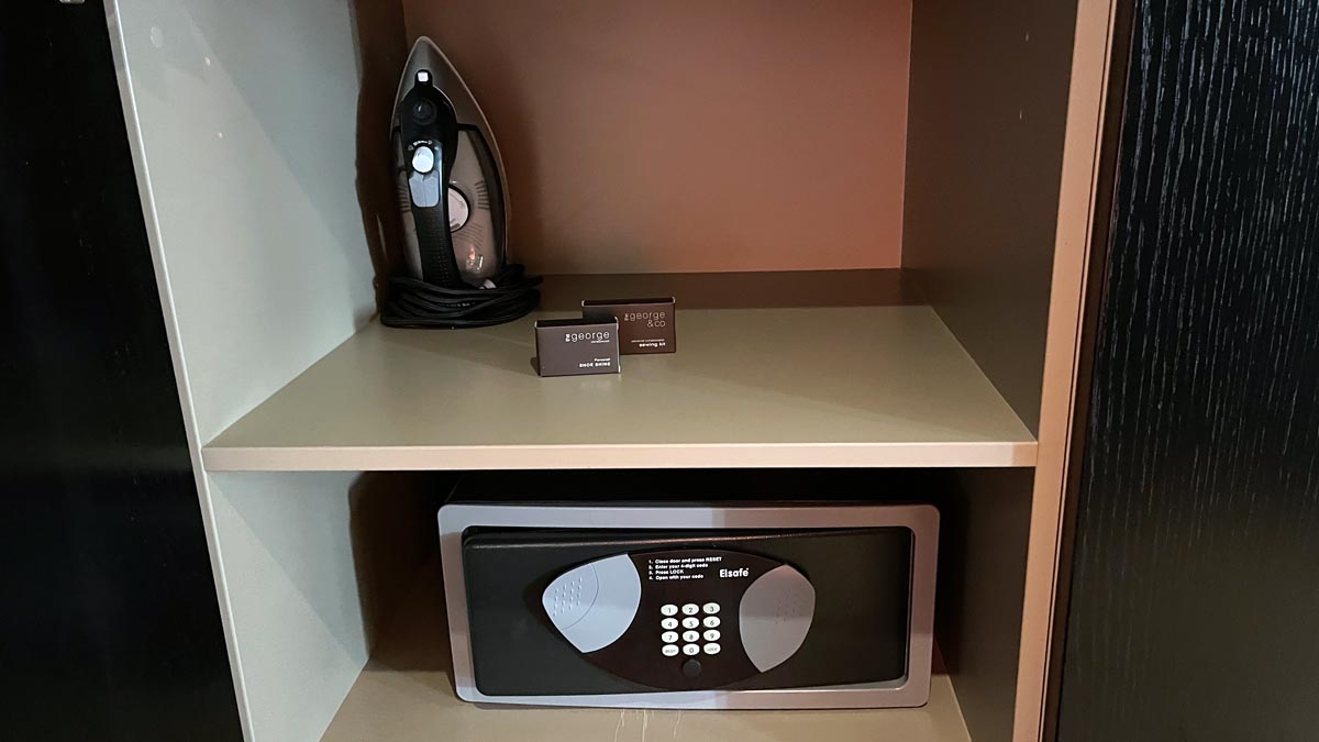 a iron and a safe on a shelf