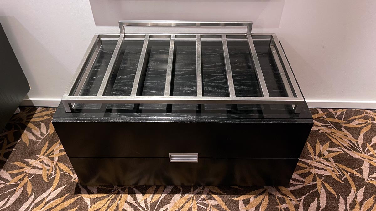 a black drawer with metal shelves