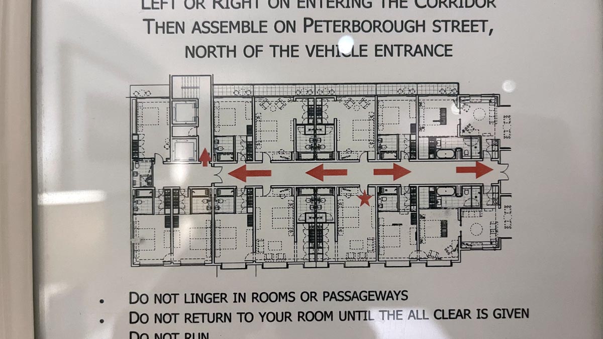 a sign with a diagram of a building