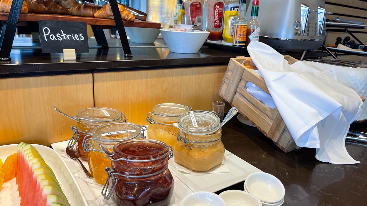 jars of jam and sauce on a table