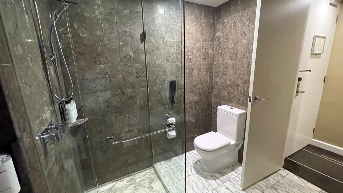 a bathroom with a glass shower door