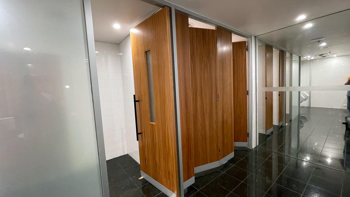 a row of doors in a bathroom