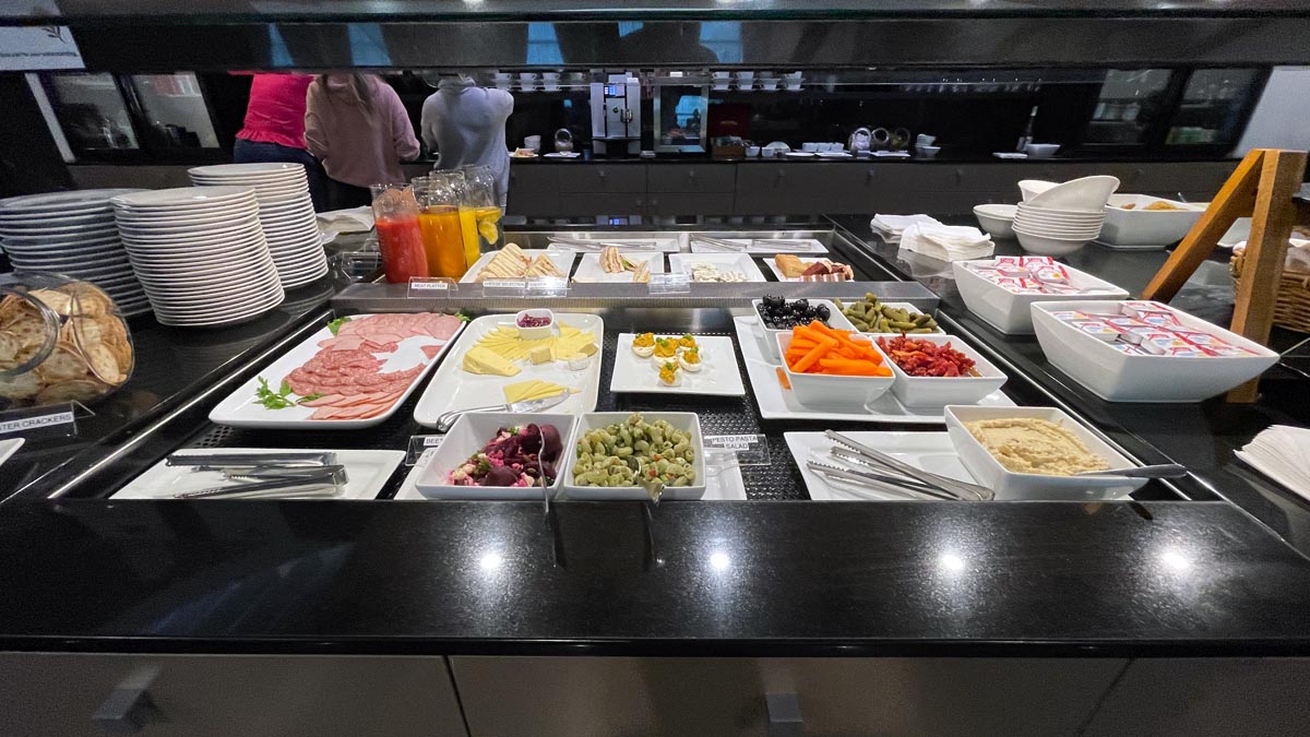 a buffet line with different food items on it