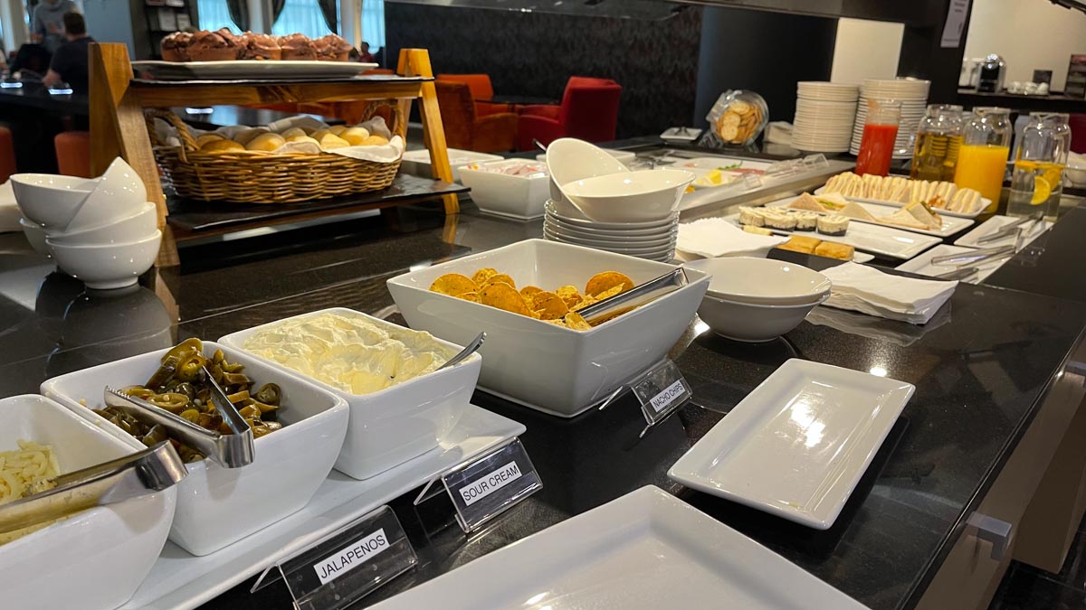 a buffet table with food in bowls