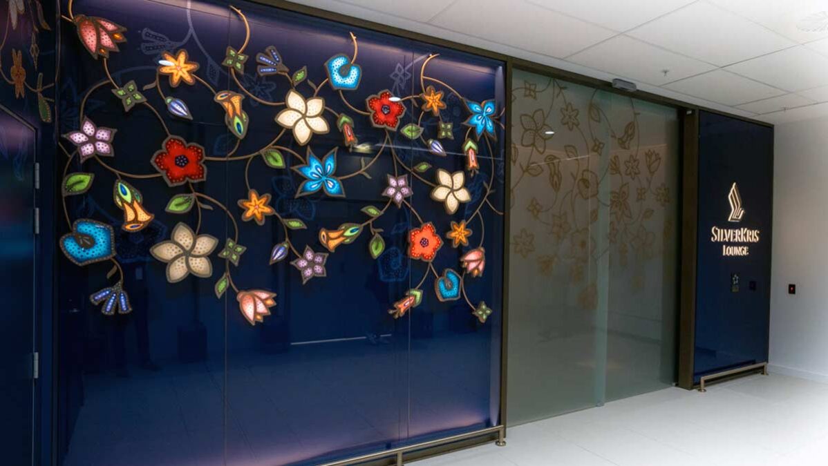 a glass wall with flowers on it