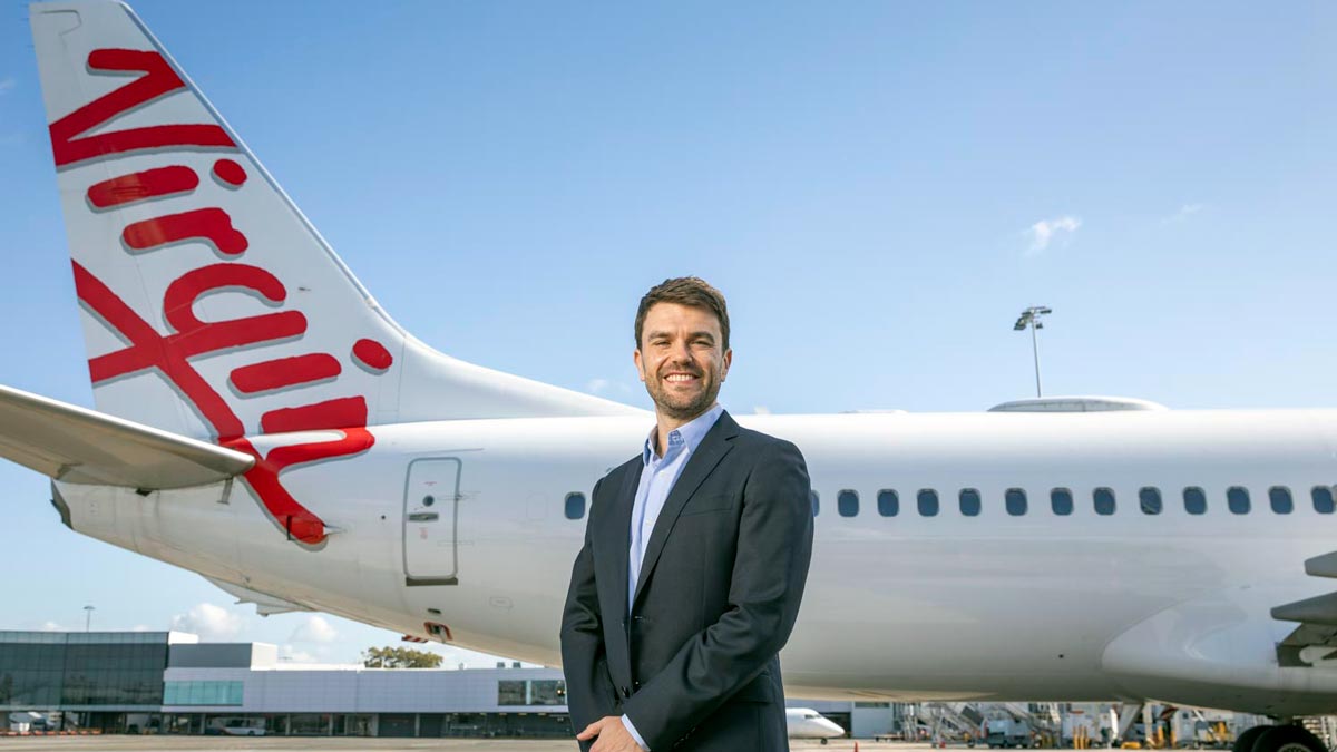 a man standing in front of a plane