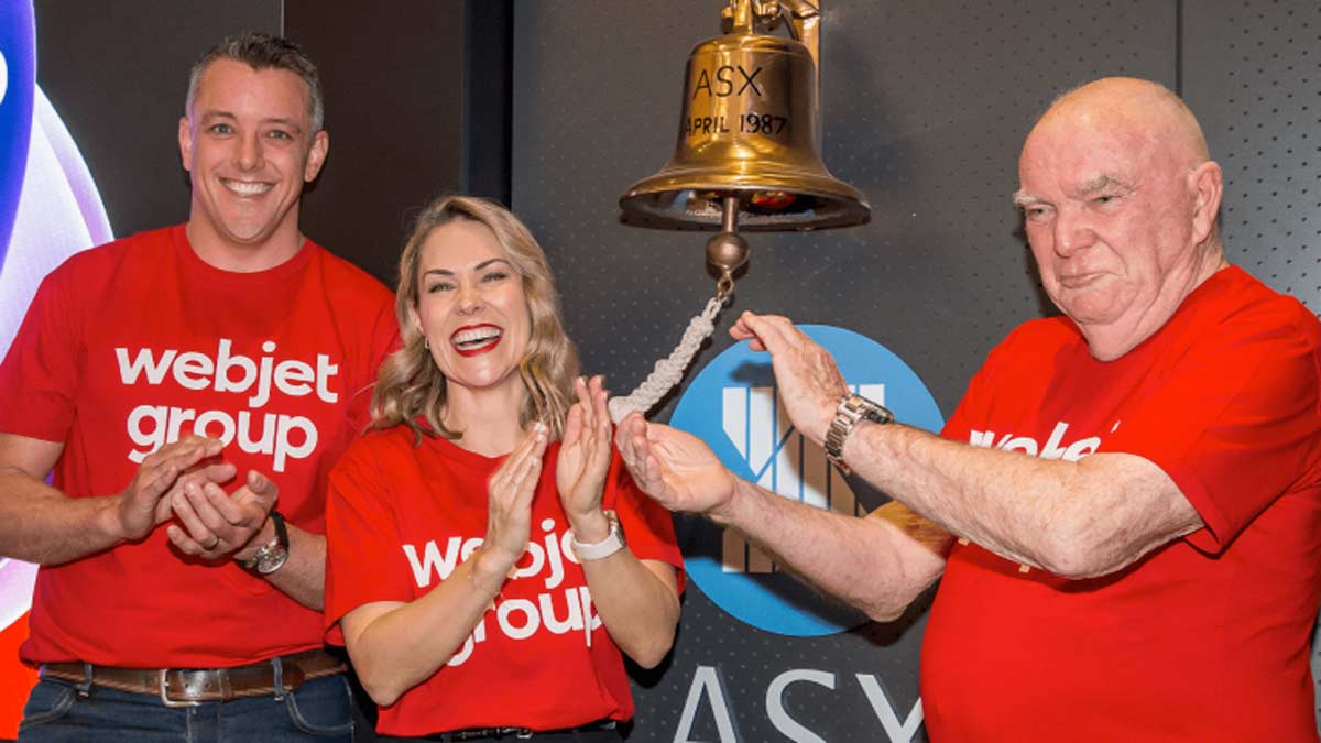 a group of people in red shirts