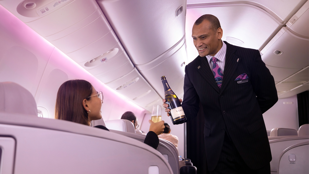 a man holding a bottle of wine