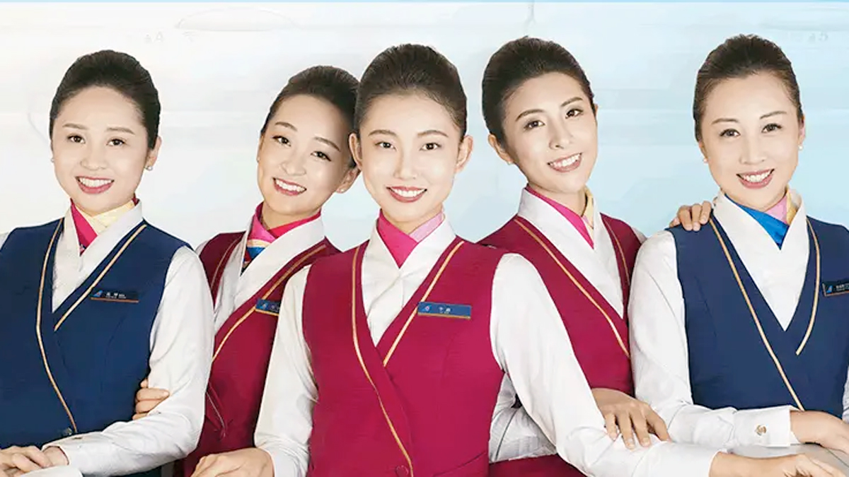 a group of women wearing red vests