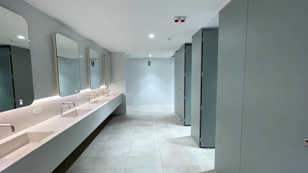 a bathroom with sinks and mirrors