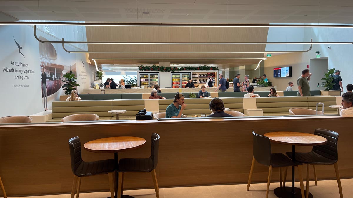 people sitting at tables in a restaurant