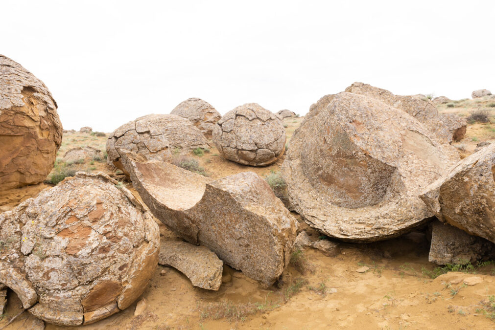 a group of large rocks in a desert