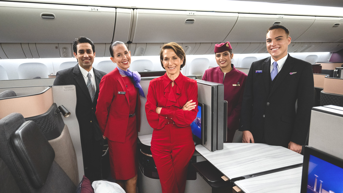 a group of people in red uniforms posing for a photo