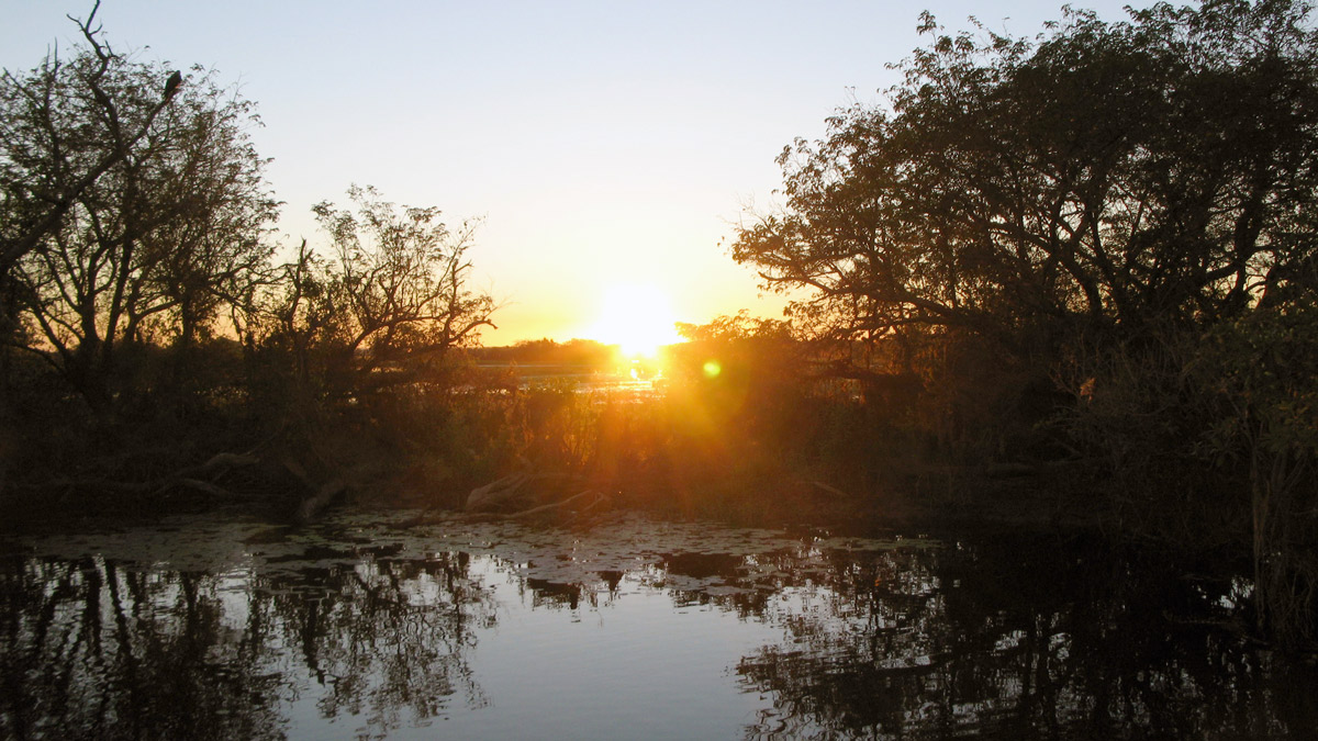 a sunset over a body of water