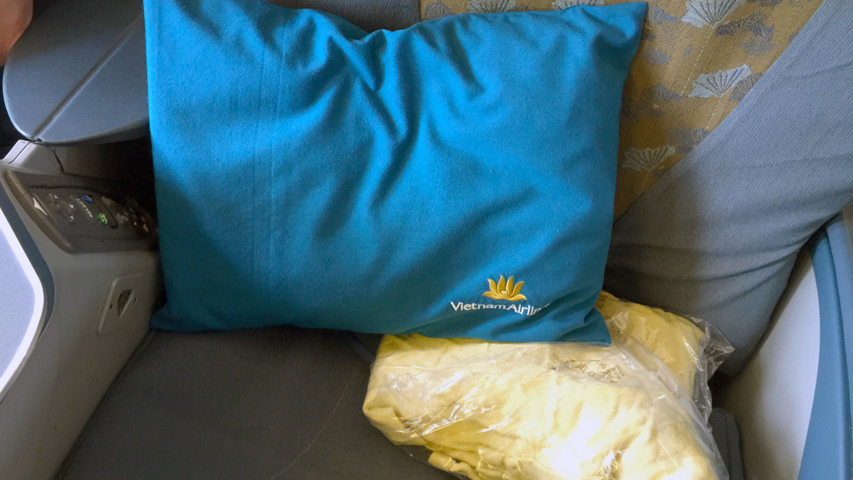 a blue pillow on a couch