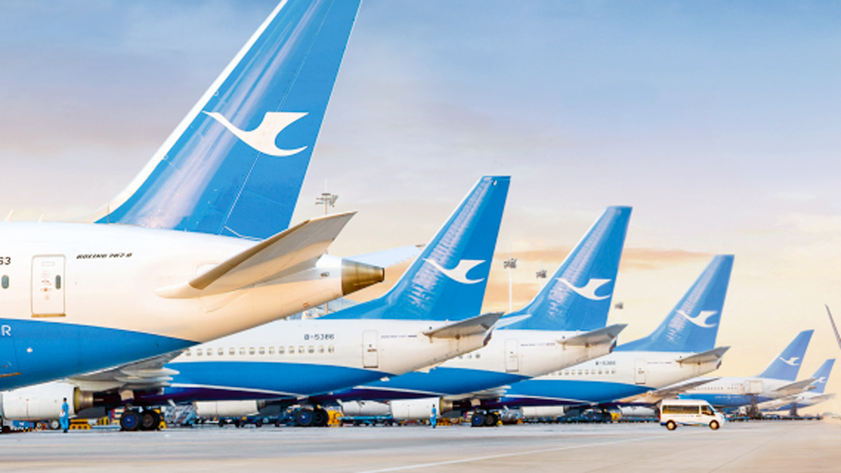 a row of airplanes parked in a row