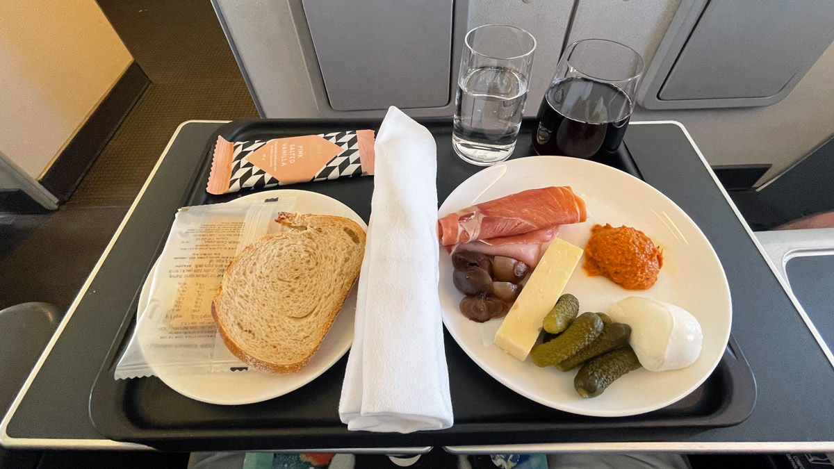 a tray with food and glasses on it